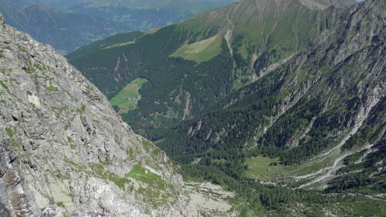 View down the valley from the Kleiner Ifinger into a mountain gap on a nice sunny day, Hafling, South Tyrol, Italy