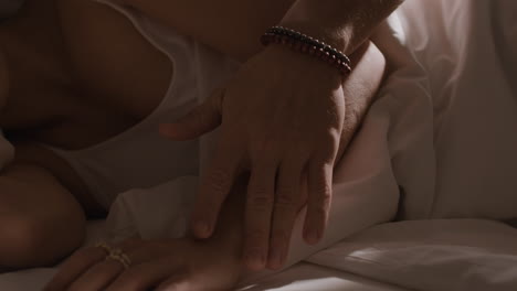 Intimate moment between a couple in bed