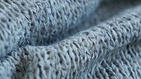 slow tilt shallow dof knitting made sweater texture details 4k 2160p 30fps ultrahd  footage - close-up of fine green knitwork fine texture 3840x2160 uhd tilting video