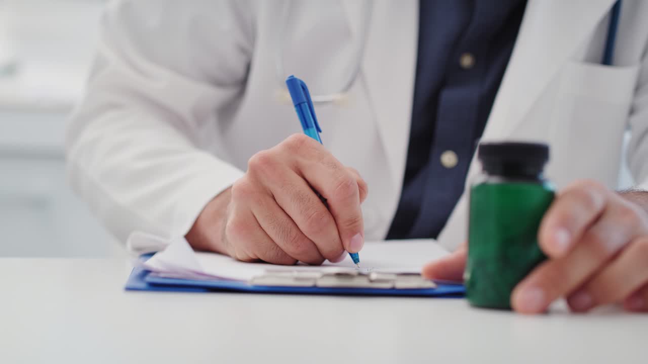 Handheld view of doctor working in his office