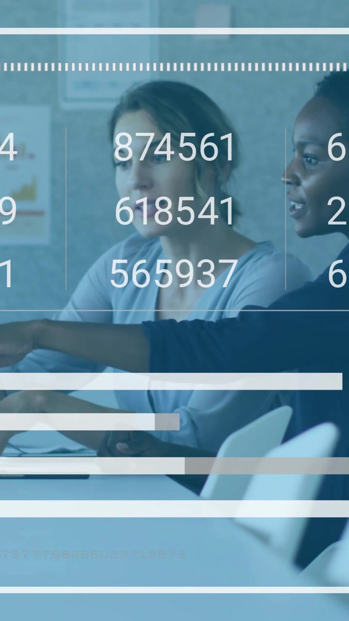 Vertical video: Two women typing and pointing on tablet causing live bars changing for sales review