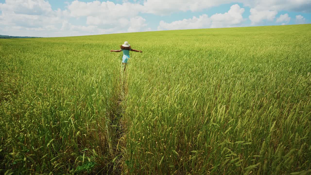 Woman Running Through a Wheat Field