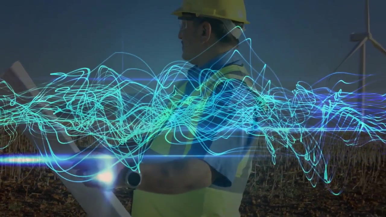 Ingeniør gennemgår vindmølleplaner med digital dataoverlejring