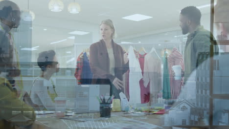 animation of multiracial designers sharing ideas in office on aerial view of buildings in background