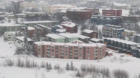 drone shot of housing in anchorage alaska with snowy weather