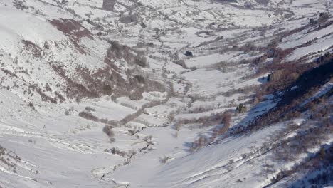 Snow-covered-valley-seen-from-a-mountain-top