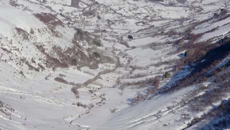 snow covered valley seen from a mountain top