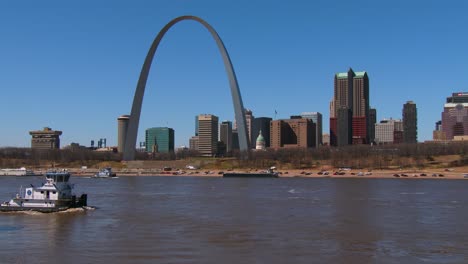 a tugboat travels on the mississippi river near st louis