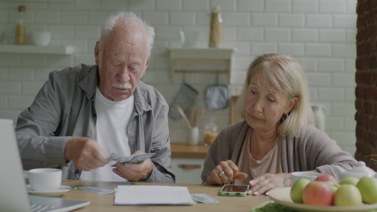 Senior Couple Managing Finances at Home