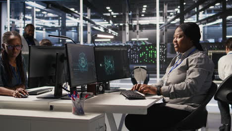 Vertical video Data center developer doing software updates, looking at watch