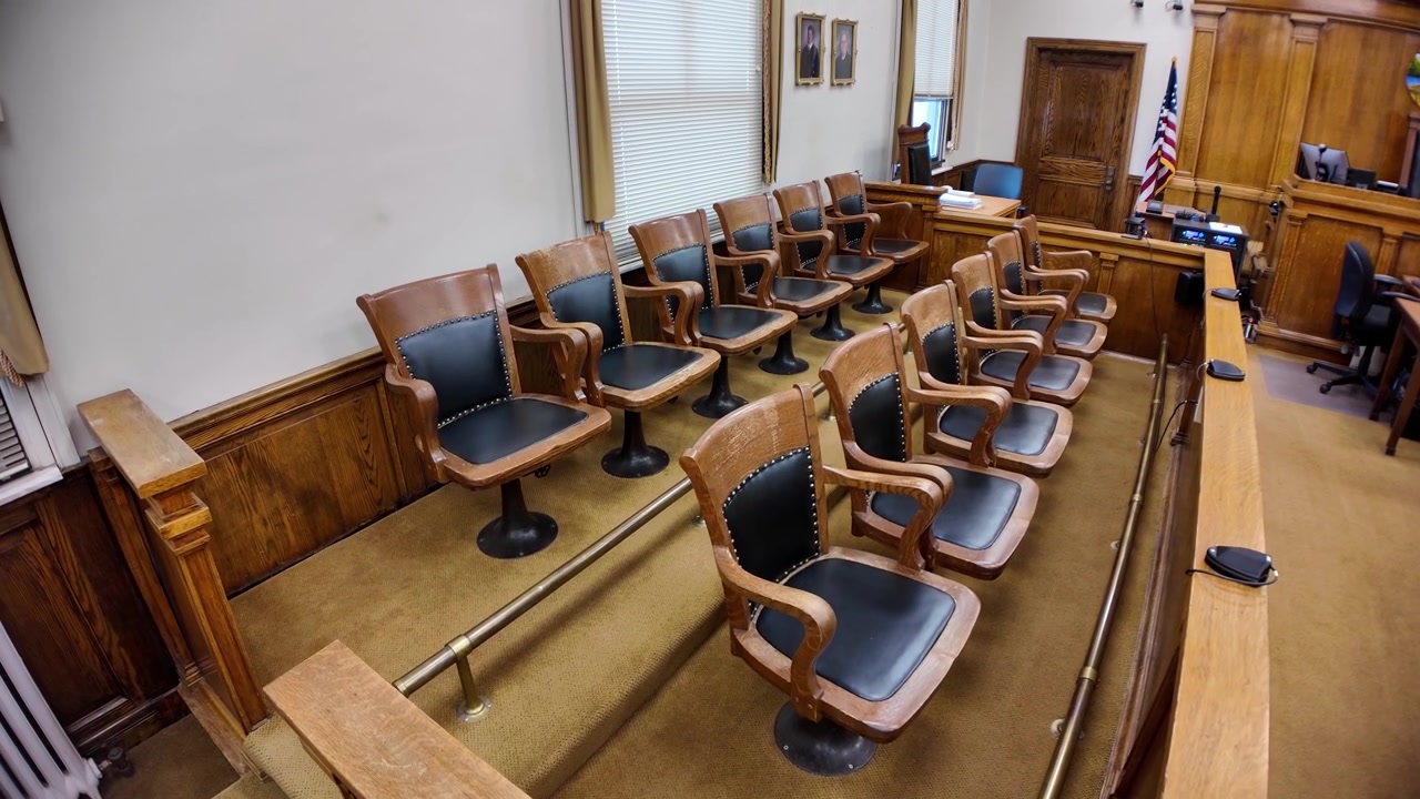 Rising gimbal shot of jury seats in a courtroom in the historic Hocking County Courthouse