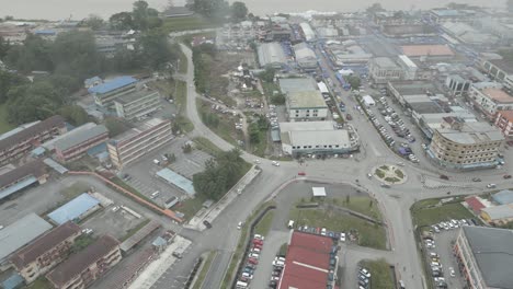 foggy morning beautiful drone view of sri aman town at batang lupar river, during regatta and pesta benak,sarawak, borneo.