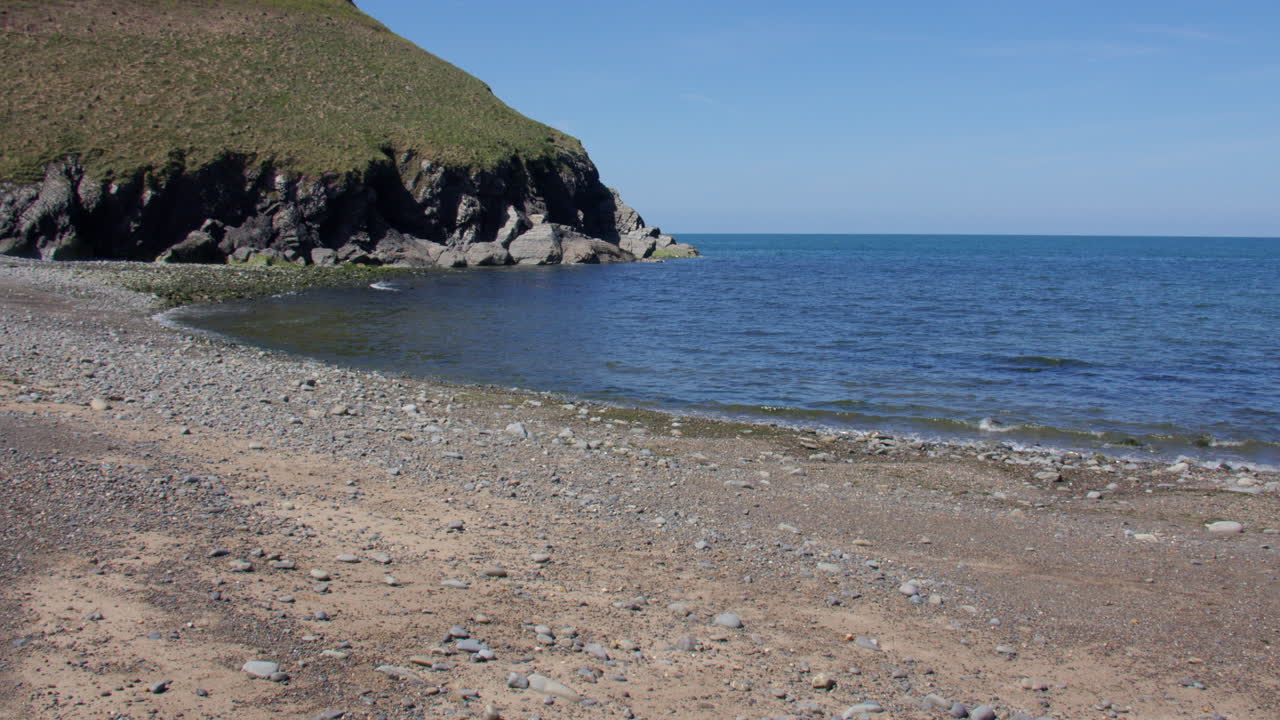 Extra wide shot of Cwmtydu beach at low tide