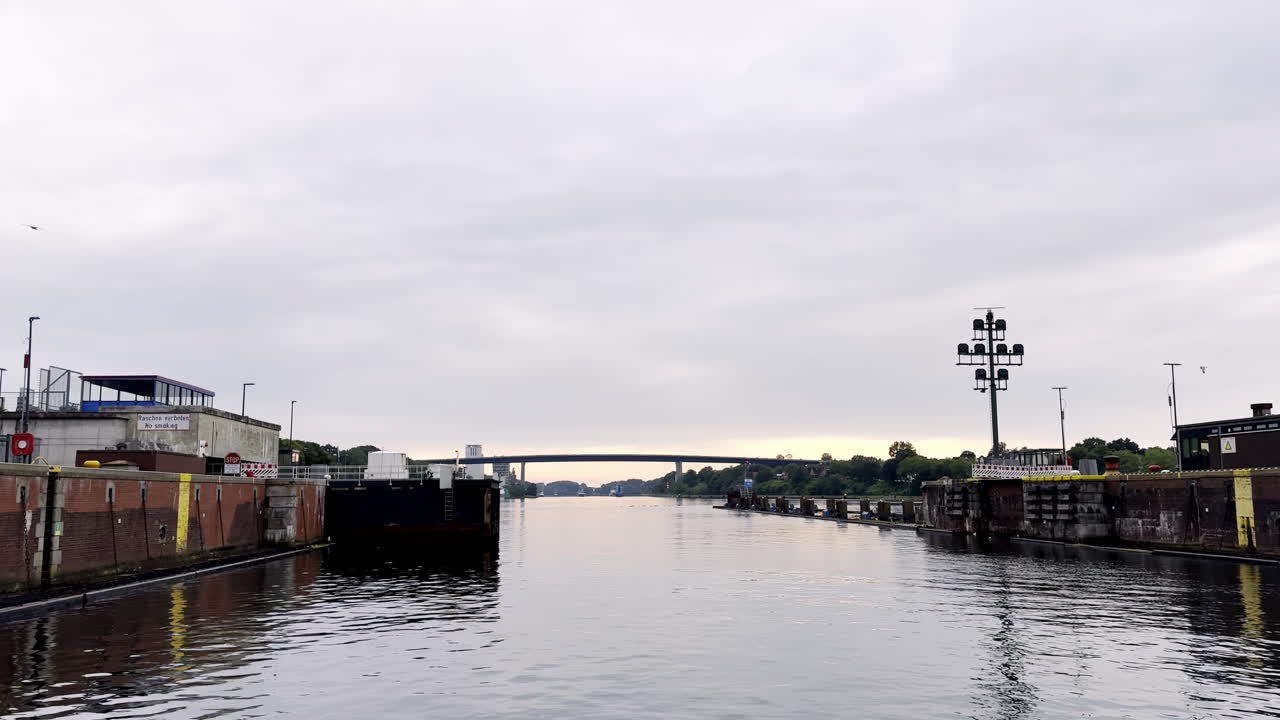 Kiel Canal's Locks Stand Open Awaiting Ships as the Sun Rises Paints the Sky with Pastel Colors Waterway at Dawn