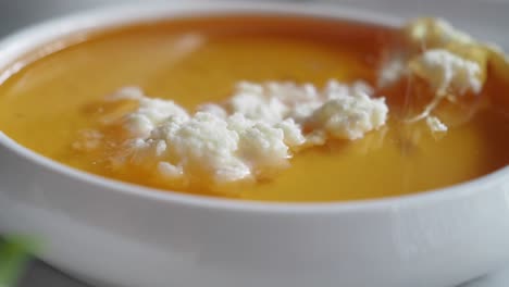 close up of creamy honeycomb with honey