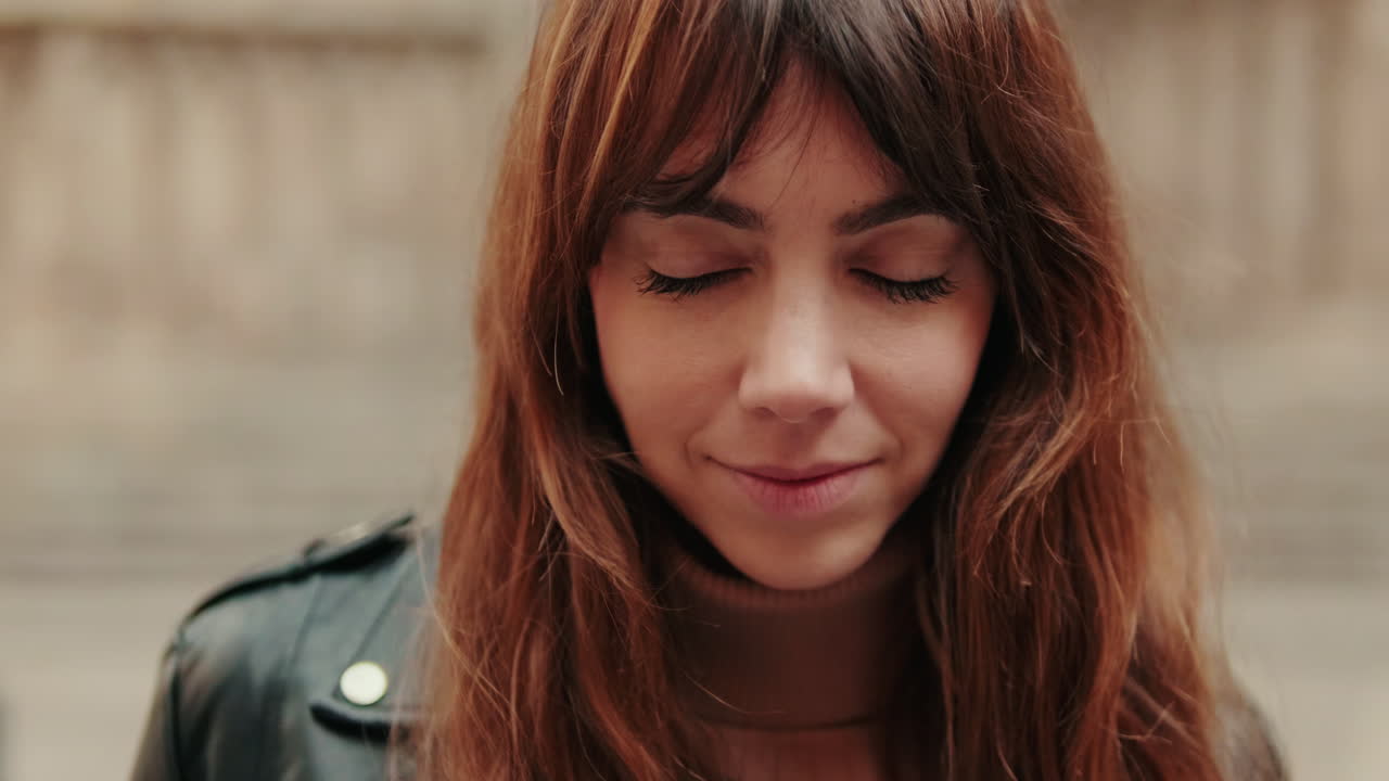 Close Up Portrait of a Young Woman Opening Eyes and Smiling