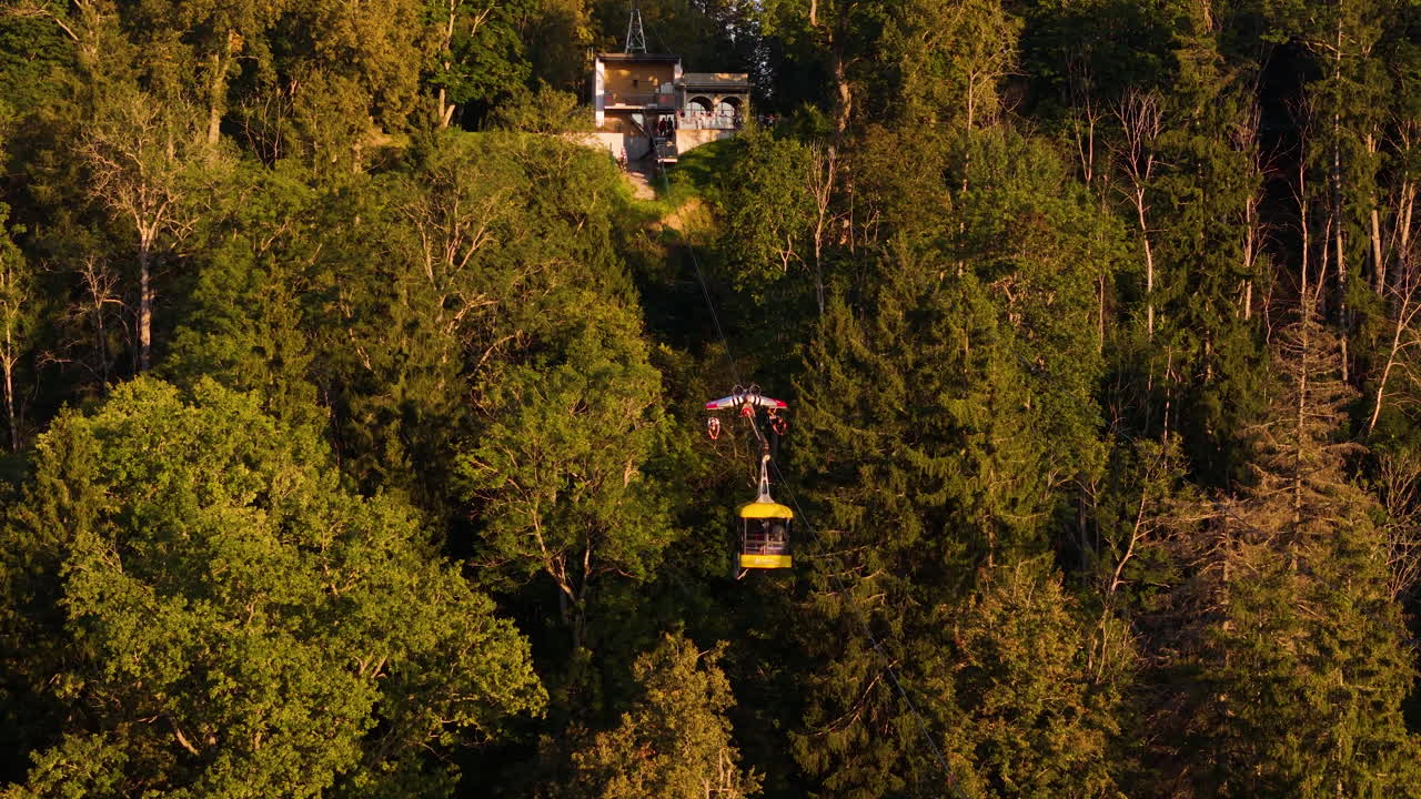 Cable Car Tours And Ziplining Adventures In Sigulda, Latvia. 4K Aerial Tracking Shot Over The Scenic Forest Landscapes Of Guaja National Park.