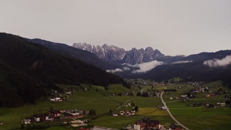 alpine valley with mountain range and village