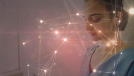 Animation-of-connections-with-lights-over-biracial-woman-using-smartphone