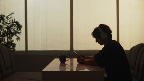 person listening to music and using phone