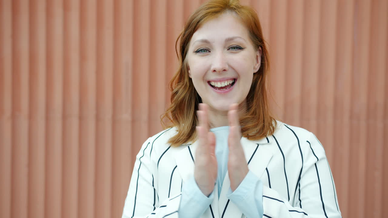 Woman clapping and expressing gratitude