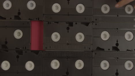 VHS-cassettes-on-burgundy-background