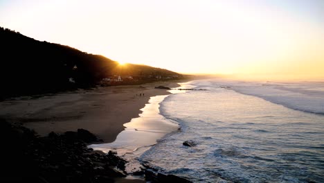 Sunrise-over-the-wide-stretch-of-beach-of-Wilderness,-South-Africa