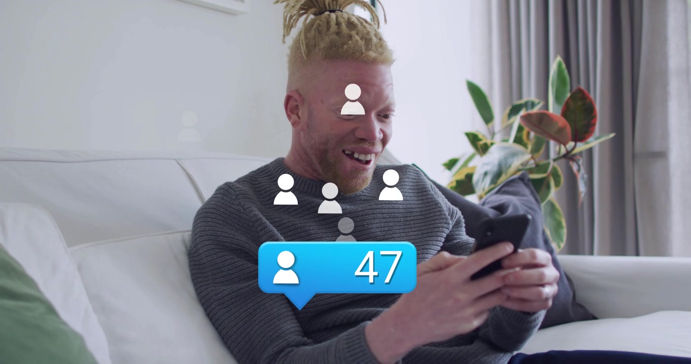 Man on sofa tapping phone, checking rising social counter as alert appearing and avatars floating