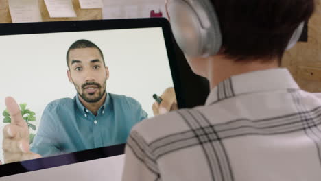 business woman using video chat talking to businessman colleague on computer screen brainstorming ideas sharing connection enjoying online communication in office workplace