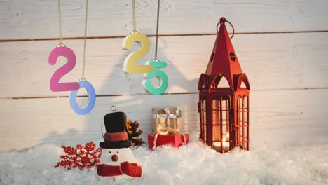 animation of 2025 text and christmas decorations in background