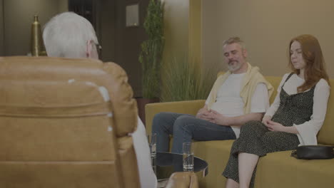 man and woman visiting psychologist.