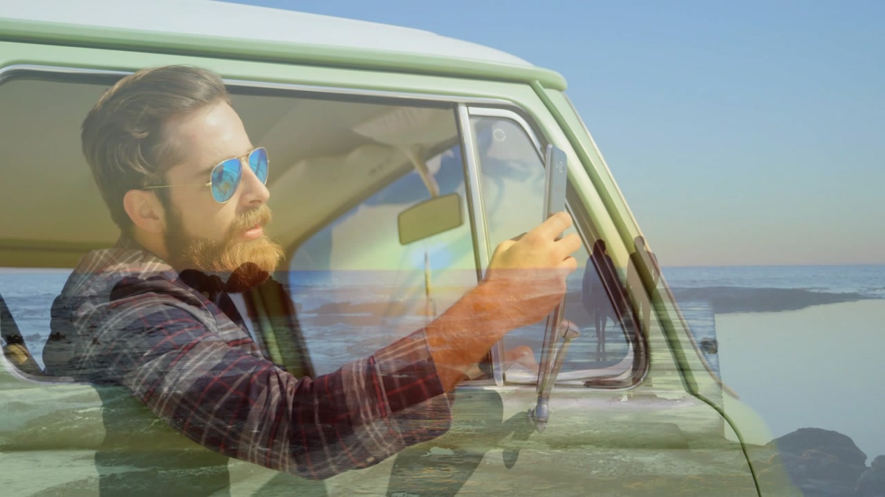 Vertical video: Driver tuning mirror to catch sun, sun showing travel overlay with pier couple