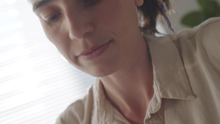 Young Woman Weaving Macrame Decor at Home