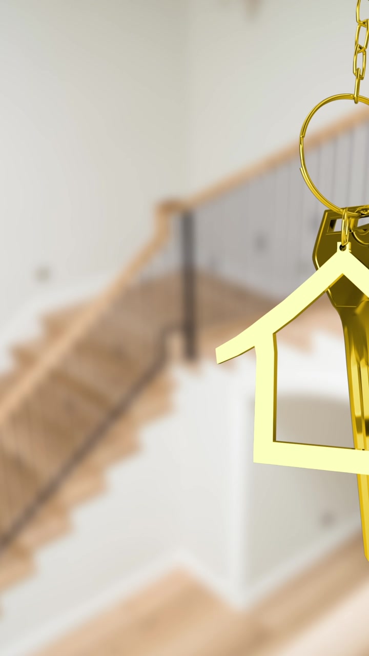 Animazione di chiave d'oro e portachiavi a forma di casa su interno di casa sfocato