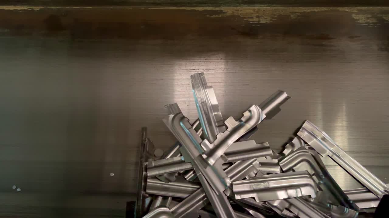 Working factory conveyor bring the metal parts