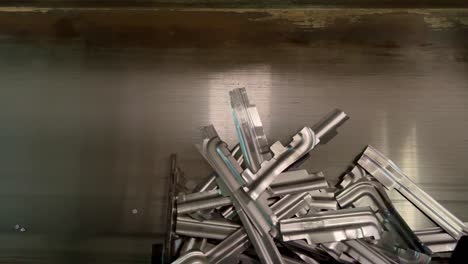 working factory conveyor bring the metal parts