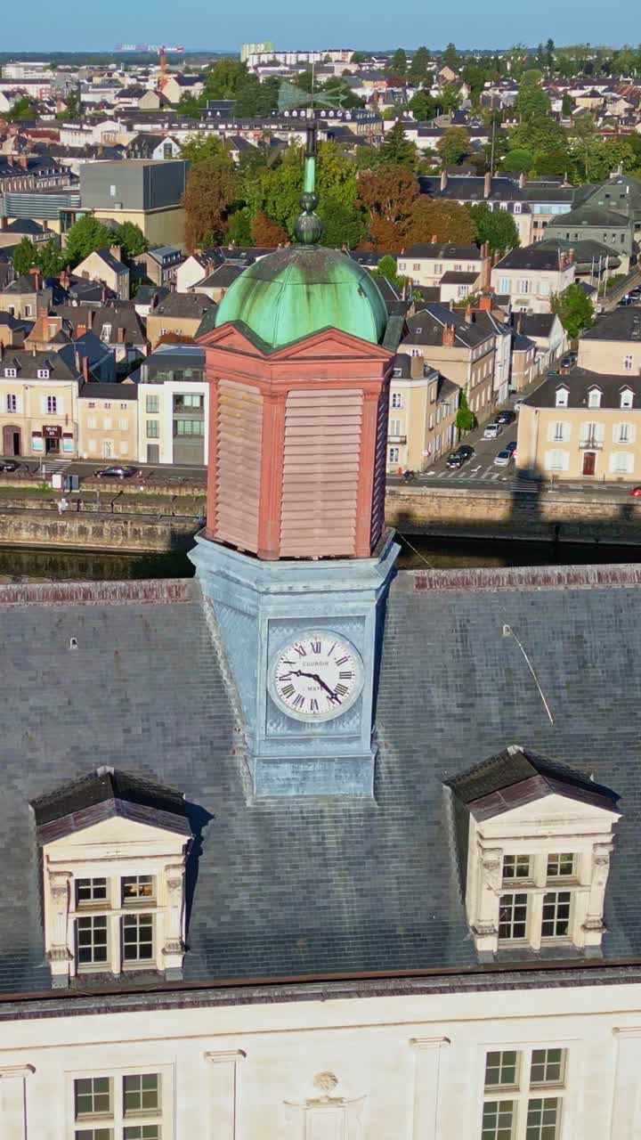 Close-up vertical view of rooftop clock of Chateau-neuf on Place de Trémoille, Laval, Mayenne, France