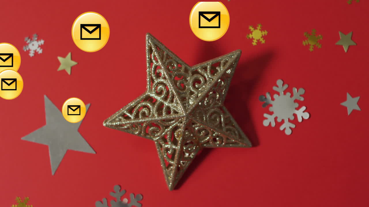 Email icons and snowflakes with golden star ornament on red background animation