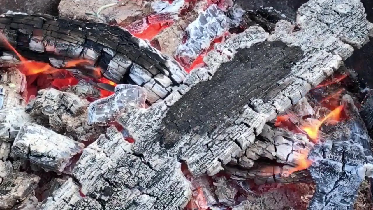 Embers of fire. Glowing Hot Charcoal close up of Burning firewood