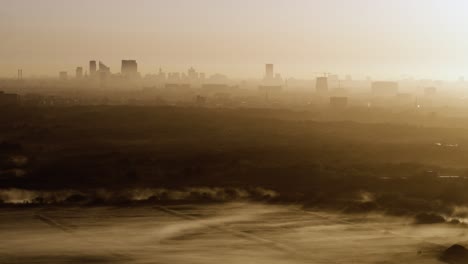 city sunrise in fog