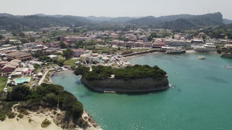 drone flight along scenic coastline of touristy sidari, corfu, greece