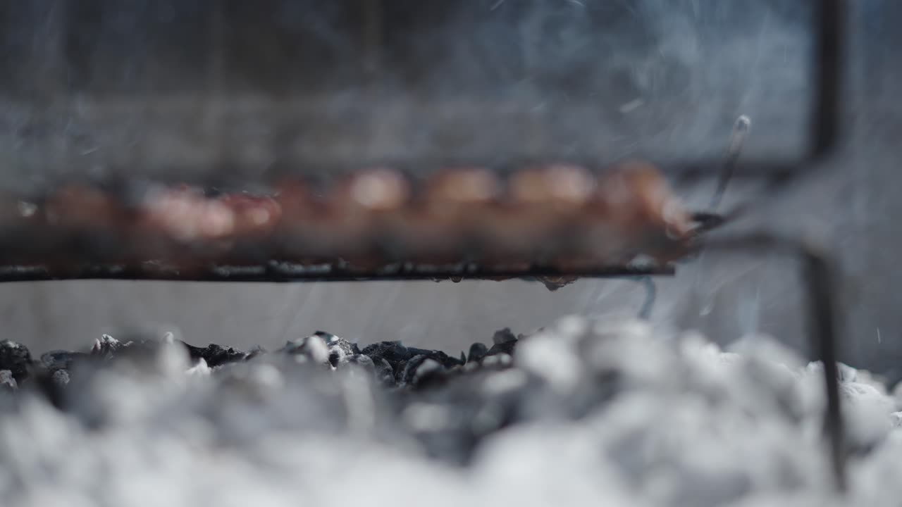 Food Grilling on a Barbecue with Rising Smoke