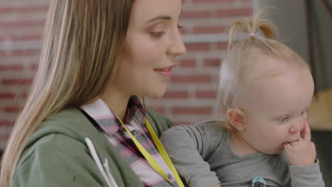 close-up-caucasian-business-woman-mother-holding-baby-discussing-corporate-project-meeting-colleagues-multitasking-in-office-workplace