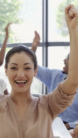 close up on businesswoman raising arms for success