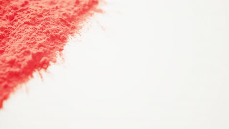 video of red coloured powder with copy space on white background