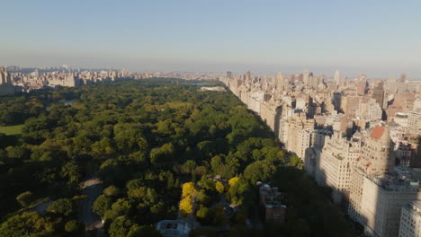 drone shot tilting over the central park, autumn golden hour in manhattan, nyc