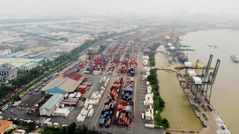 thick smog hangs over vietnam international container terminals, saigon river