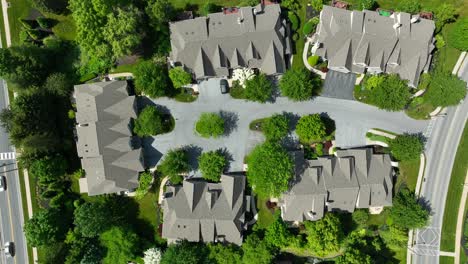 Aerial-view-of-two-story-townhomes-on-a-cul-de-sac-with-meticulous-landscaping-and-mature-trees