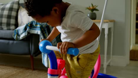 Side-view-of-cute-little-black-boy-playing-in-a-comfortable-home-4k