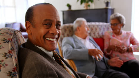 Group-of-Mixed-race-senior-friends-interacting-with-each-other-at-nursing-home-4k